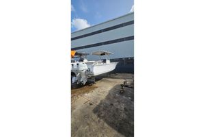 Southport 26 Center Console 2007 Southport 26 Center Console boat on dry dock near industrial building.