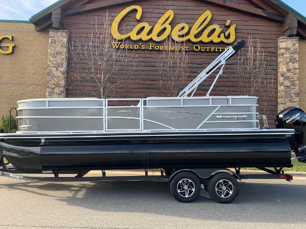 Ranger Reata 223C 2024 Ranger Reata 223C pontoon boat displayed outside Cabela's store.