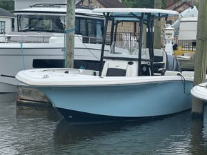 Tidewater 220 LXF 2022 Tidewater 220 LXF boat docked in marina, featuring sleek design and light blue hull.
