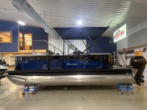 Barletta A20QC 2025 Barletta A20QC pontoon boat displayed indoors with Mercury outboard motor.