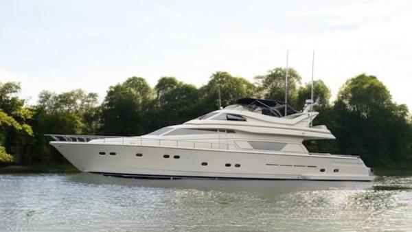 Ferretti Yachts 80 RPH 2001 Ferretti Yachts 80 RPH luxury yacht cruising on a serene waterway.
