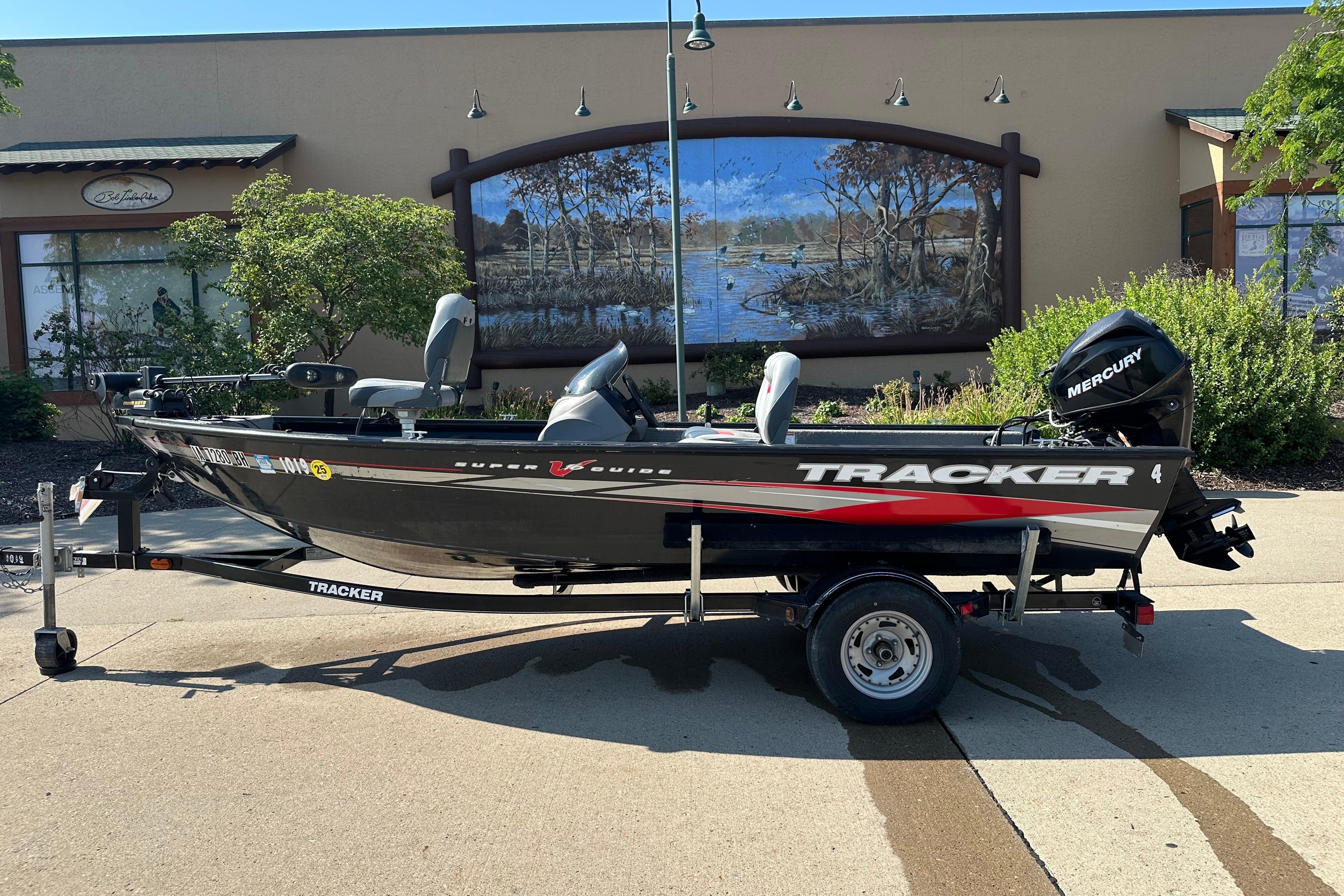 Tracker Super Guide V 16 SC 2011 Tracker Super Guide V 16 SC boat on trailer, parked outdoors.
