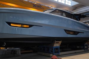 Solaris Power 52 Coupe 2026 Solaris Power 52 Coupe yacht in a workshop, showcasing sleek design and modern features.