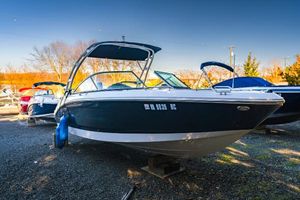 Chaparral 210 Suncoast 2018 Chaparral 210 Suncoast boat on display in a sunny outdoor setting.