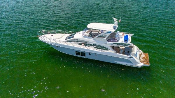 Azimut 64 Fly 2013 Azimut 64 Fly luxury yacht cruising on green waters.