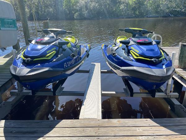 Sea-Doo Wake Pro 230 Two 2020 Sea-Doo Wake Pro 230 jet skis docked on a sunny day.