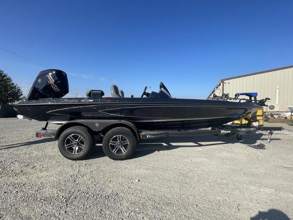 Triton 20XP 2024 Triton 20XP black fishing boat on trailer.