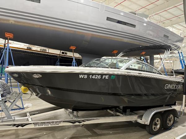 Four Winns H210 2018 Four Winns H210 boat on trailer in indoor storage facility.