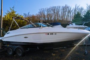 Sea Ray 220 Sundeck 2015 Sea Ray 220 Sundeck boat on trailer, parked outdoors.