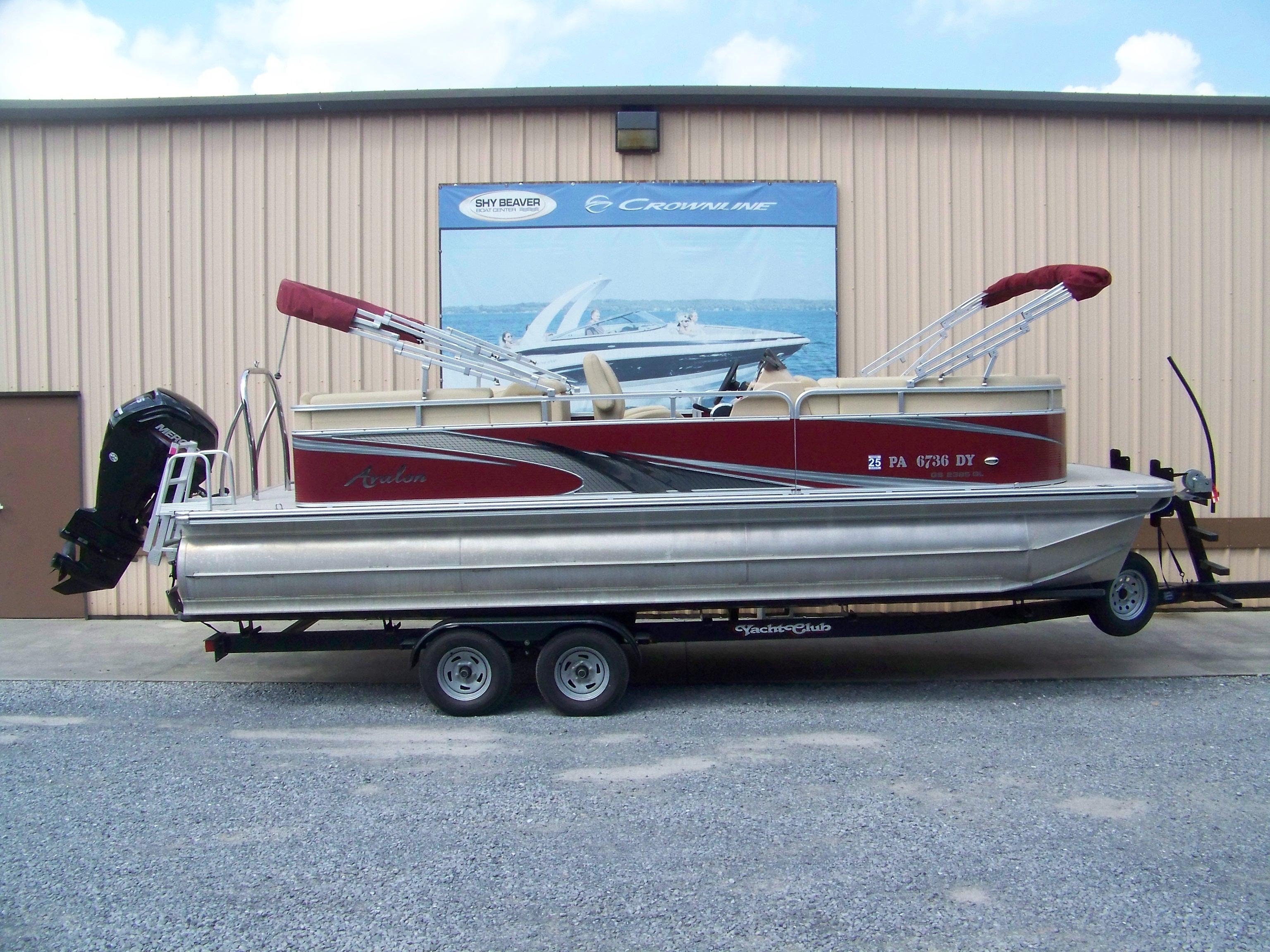 Avalon GS Quad Lounger - 23' 2020 Avalon GS Quad Lounger 23' pontoon boat on trailer, parked outside a building.