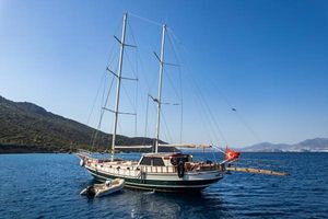 Custom custom Sailing yacht with two masts anchored in a serene bay, 1990 custom model.