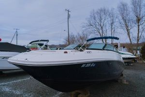 Sea Ray 220 Sundeck 2013 Sea Ray 220 Sundeck boat on display in a marina setting.