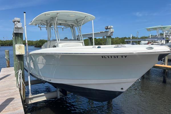 Robalo R300 Center Console 2015 Robalo R300 Center Console boat docked on lift in marina.