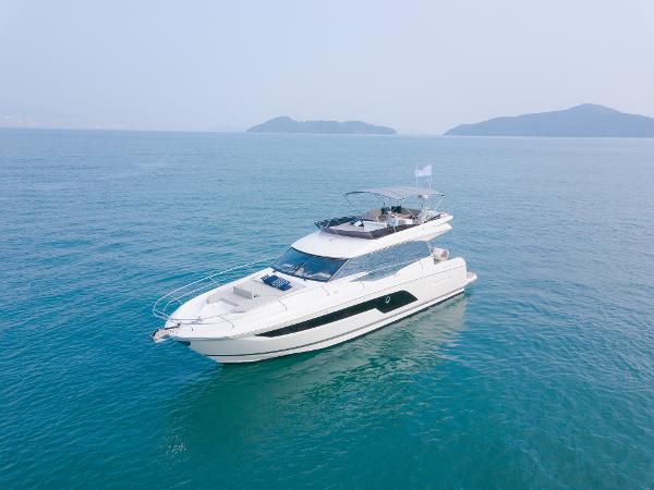 Prestige 590 Luxury 2025 Prestige 590 yacht cruising on serene blue waters.