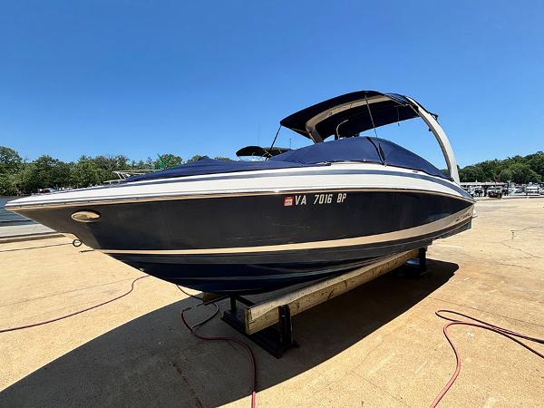 Regal 2300 RX Bowrider 2010 Regal 2300 RX Bowrider boat on trailer, blue hull, sunny day.