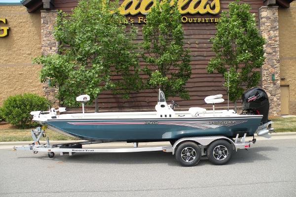 Ranger RB210 2024 Ranger RB210 boat on a trailer in front of Cabela's store.