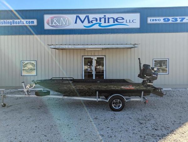 Gator-tail 1750 Savage Series 2025 Gator Tail 1750 Savage Series boat on trailer outside marine dealership.