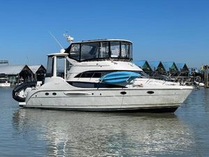 Meridian 459 Motoryacht 2004 Meridian 459 Motoryacht on calm water, clear sky, docked near marina.