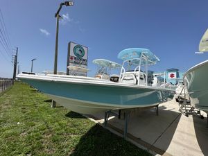 Sea Pro 250 Bay 2026 Sea Pro 250 Bay boat displayed outdoors under clear blue sky.