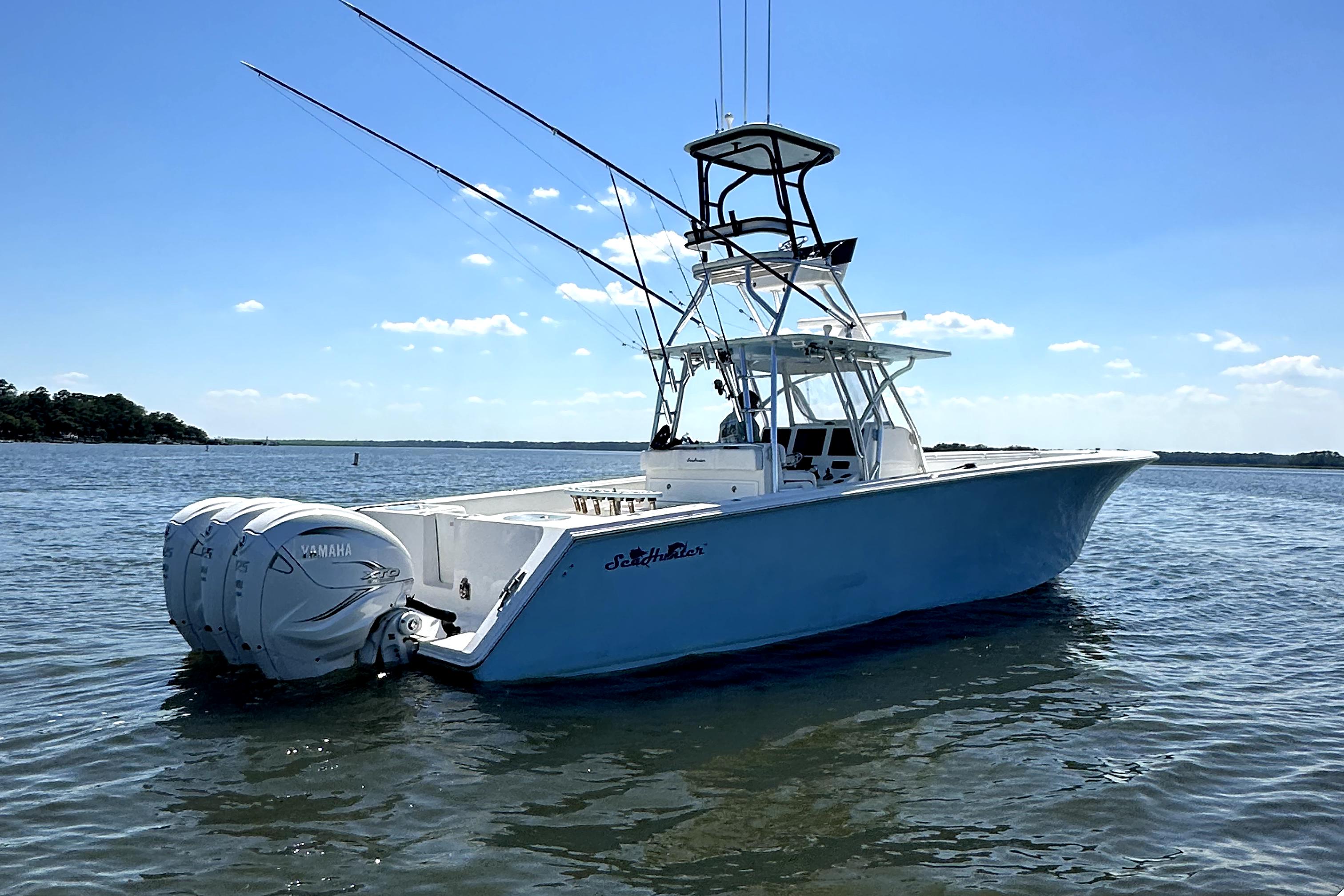 SeaHunter 41 Tournament 2015 SeaHunter 41 Tournament boat on calm water under clear blue sky.