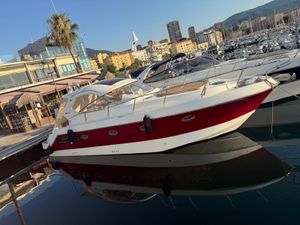 Mano Marine 35 ht 2010 Mano Marine 35 HT yacht docked in a marina, with cityscape background.