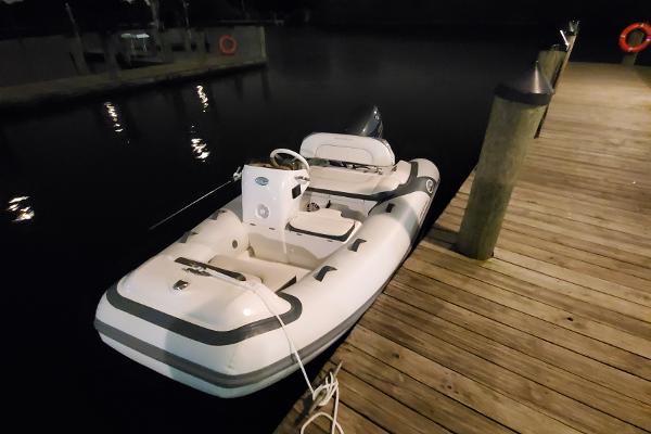 Walker Bay Generation 11 LTE Walker Bay Generation 11 LTE 2025 inflatable boat docked at night.