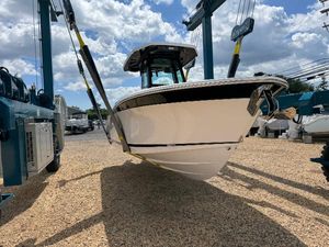 Blackfin 252 CC 2025 Blackfin 252 CC boat in dry dock under a cloudy sky.