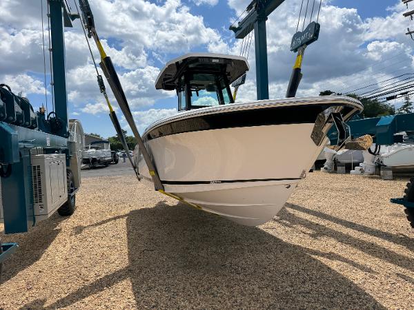Blackfin 252 CC 2025 Blackfin 252 CC boat in dry dock under a cloudy sky.