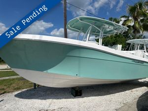 Aquasport 2500 CC 2024 Aquasport 2500 CC boat with "Sale Pending" banner, displayed outdoors.