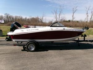 Tahoe 200 S 2024 Tahoe 200 S boat on trailer, parked outdoors, side view.