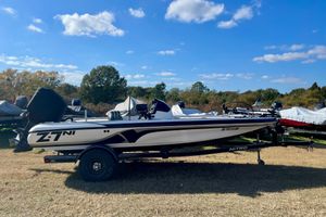 Nitro Z-7 2010 Nitro Z-7 boat on trailer, parked outdoors under a clear blue sky.
