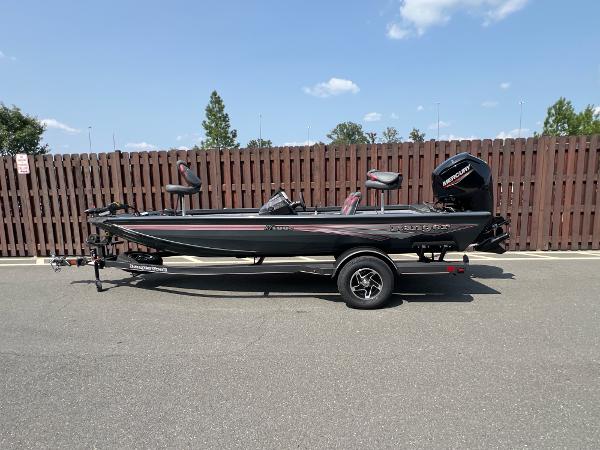 Ranger RT188C 2024 Ranger RT188C boat on trailer, parked outdoors, side view.