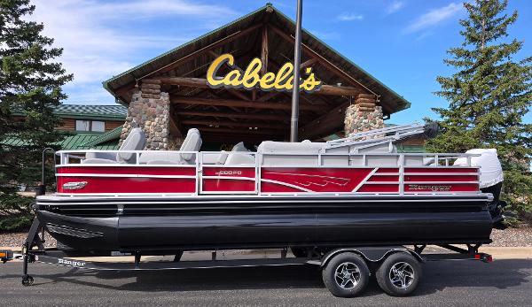 Ranger Reata 200C 2024 Ranger Reata 200C pontoon boat displayed outside Cabela's store.
