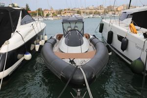 Panamera Yacht PY100 2021 Panamera Yacht PY100 docked between two boats in a marina.