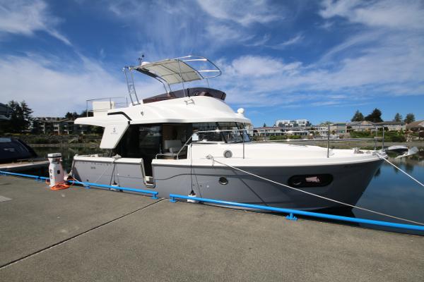 Beneteau Swift Trawler 35 2022 Beneteau Swift Trawler 35 docked under a clear blue sky.