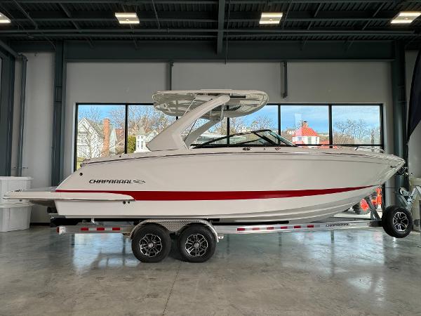 Chaparral 287 SSX 2024 Chaparral 287 SSX boat on a trailer in a showroom.