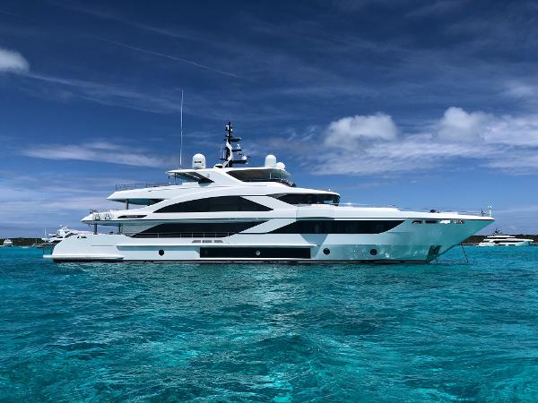 Majesty 140 Luxurious 2026 Majesty 140 yacht on clear turquoise waters under a blue sky.