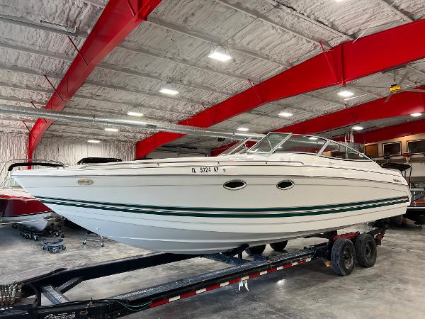 Formula 330 SS Sun Sport 1999 Formula 330 SS Sun Sport boat on trailer in indoor storage facility.
