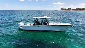 Blackfin 332 CC 2020 Blackfin 332 CC boat on clear blue ocean near coastline.
