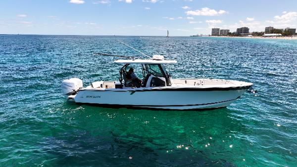 Blackfin 332 CC 2020 Blackfin 332 CC boat on clear blue ocean near coastline.
