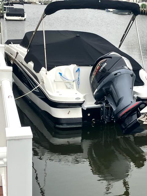 Hurricane SunDeck 2400 OB 2022 Hurricane SunDeck 2400 OB boat docked, featuring a Yamaha outboard motor.