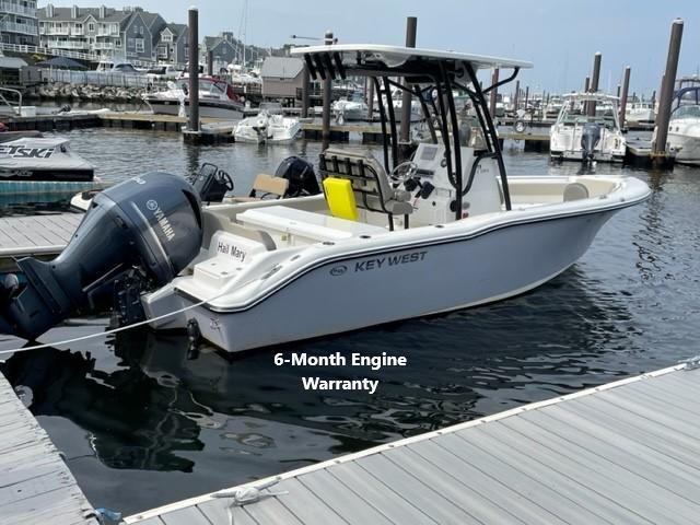 Key West 239 FS 2023 Key West 239 FS boat docked, featuring a 6-month engine warranty.