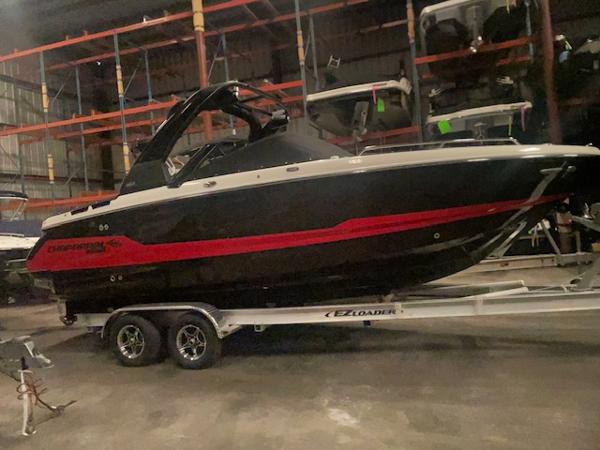 Chaparral 26 Surf 2025 Chaparral 26 Surf boat on trailer in storage facility.
