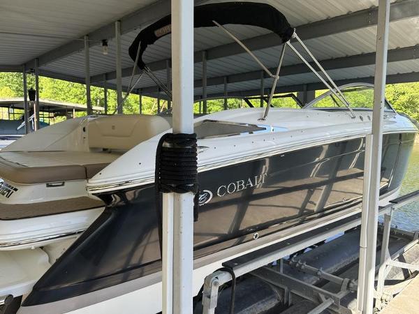 Cobalt 302 2010 Cobalt 302 boat docked under a covered marina.