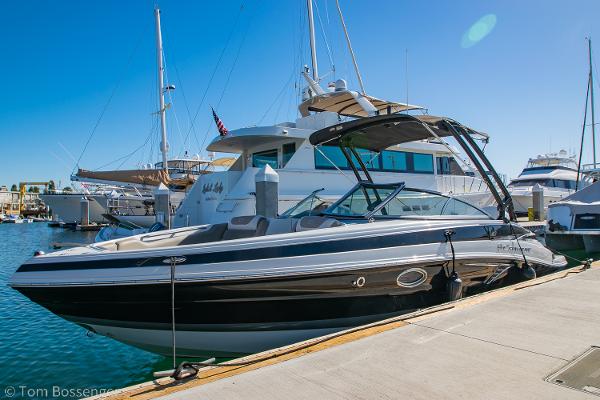 Crownline 255 XSS 2021 Crownline 255 XSS boat docked at marina under clear blue sky.