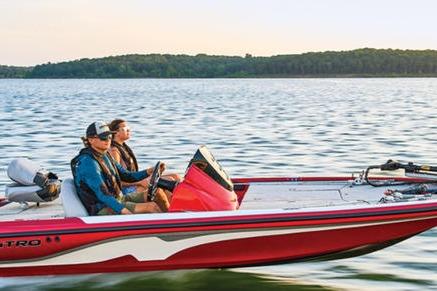Nitro Z17 Two people on a 2026 Nitro Z17 boat cruising on a lake.