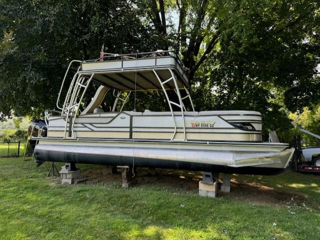 Crest Caribbean 250 L 2017 Crest Caribbean 250 L pontoon boat on blocks under trees.