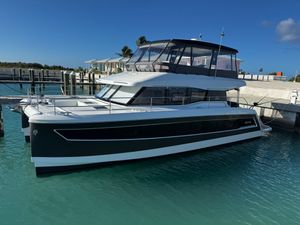 Fountaine Pajot MY6 2024 Fountaine Pajot MY6 motor yacht docked in harbor.