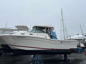 Striper 270 Walkaround 2017 Striper 270 Walkaround boat on stands in a marina setting.
