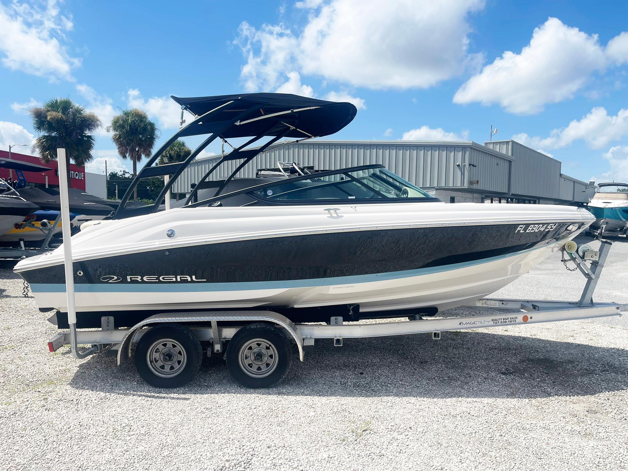 Regal 2000 ES Bowrider 2021 Regal 2000 ES Bowrider on trailer, parked outdoors under blue sky.